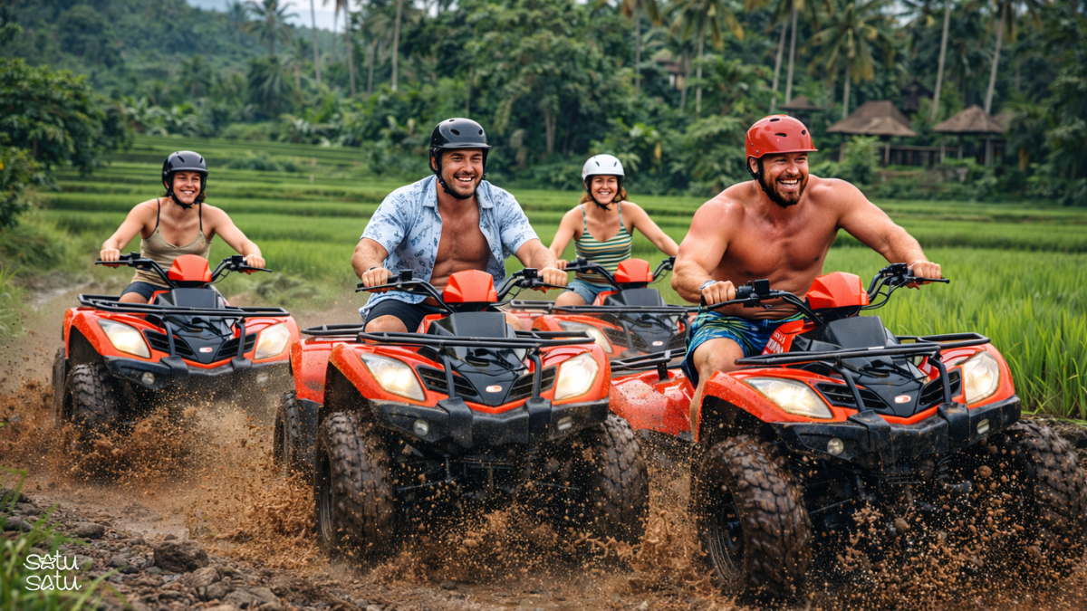 Group of friends riding ATVs through muddy trails and rice fields in Ubud, Bali